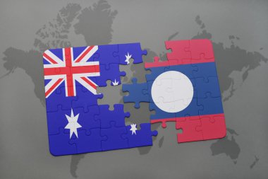 bir dünya haritası arka plan üzerinde Avustralya ve laos ulusal bayrağı ile bulmaca.