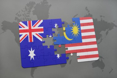 bir dünya haritası arka plan üzerinde Avustralya ve Malezya ulusal bayrağı ile bulmaca.