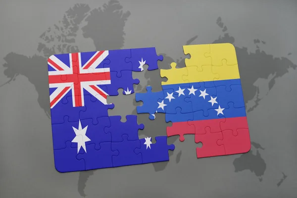 Quebra-cabeça com a bandeira nacional da Austrália e venezuela em um fundo de mapa do mundo . — Fotografia de Stock