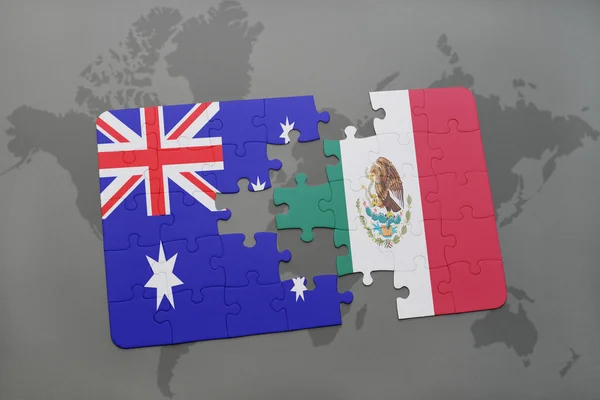 Puzzle with the national flag of australia and mexico on a world map background. — Stock Photo, Image