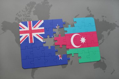 bir dünya haritası arka plan üzerinde Yeni Zelanda ve Azerbaycan ulusal bayrağı ile bulmaca
