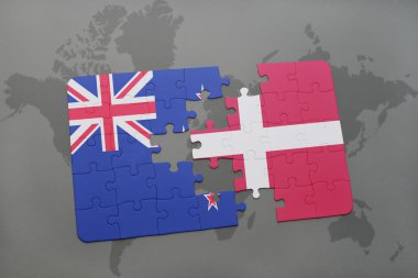 bir dünya haritası arka plan üzerinde Yeni Zelanda ve Danimarka ulusal bayrağı ile bulmaca