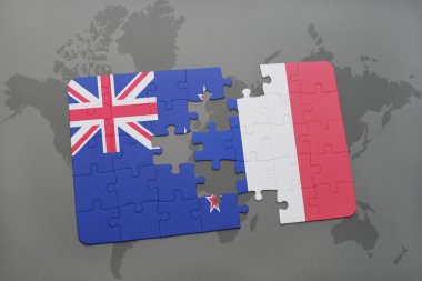 bir dünya haritası arka plan üzerinde Yeni Zelanda ve Fransa ulusal bayrağı ile bulmaca