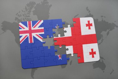 bir dünya haritası arka plan üzerinde Yeni Zelanda ve Gürcistan ulusal bayrağı ile bulmaca