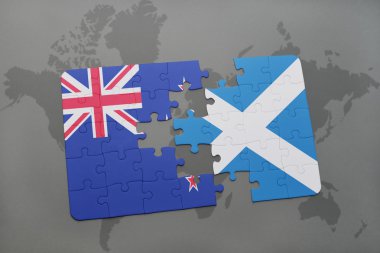 bir dünya haritası arka plan üzerinde Yeni Zelanda ve İskoçya ulusal bayrağı ile bulmaca