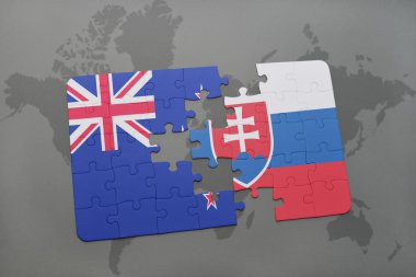 bir dünya haritası arka plan üzerinde Yeni Zelanda ve Slovakya ulusal bayrağı ile bulmaca