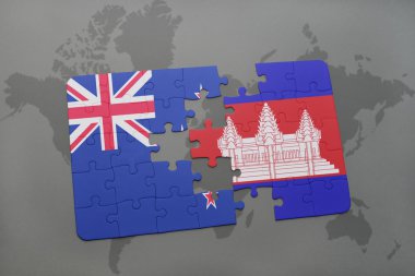 bir dünya haritası arka plan üzerinde Yeni Zelanda ve Kamboçya ulusal bayrağı ile bulmaca. 3d illüstrasyon
