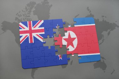 bir dünya haritası arka plan üzerinde Yeni Zelanda ve Kuzey Kore ulusal bayrağı ile bulmaca. 3d illüstrasyon