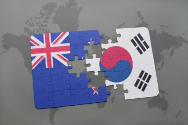 bir dünya haritası arka plan üzerinde Yeni Zelanda ve Güney Kore ulusal bayrağı ile bulmaca. 3d illüstrasyon