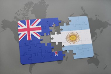 bir dünya haritası arka plan üzerinde Yeni Zelanda ve Arjantin ulusal bayrağı ile bulmaca
