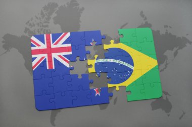 bir dünya haritası arka plan üzerinde Yeni Zelanda ve Brezilya ulusal bayrağı ile bulmaca