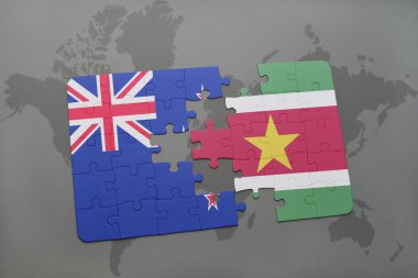 Yeni Zelanda ve Surinam ulusal bayrak dünya harita arka plan üzerinde ile bulmaca