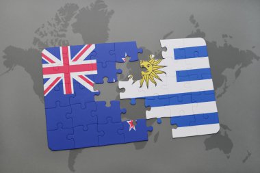 Yeni Zelanda ve uruguay ulusal bayrak dünya harita arka plan üzerinde ile bulmaca
