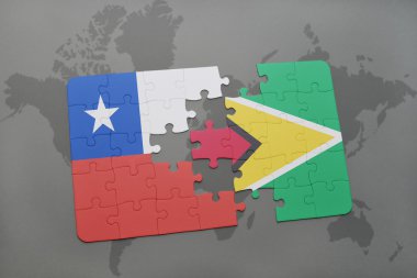 bir dünya haritası arka plan üzerinde şili ve guyana ulusal bayrağı ile bulmaca.