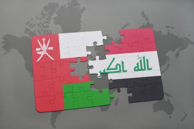 bir dünya haritası arka plan üzerinde umman ve Irak ulusal bayrağı ile bulmaca.