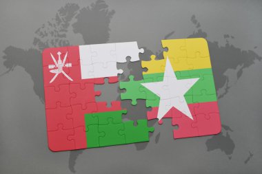 umman ve myanmar ulusal bayrağı ile bulmaca bir dünya haritası arka plan üzerinde.
