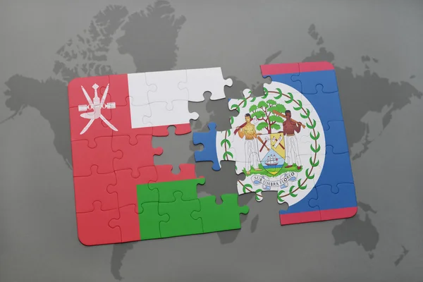 Puzzel met de nationale vlag van Oman en Belize op een wereld kaart achtergrond. — Stockfoto