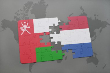 Umman ve Hollanda ulusal bayrak dünya harita arka plan üzerinde ile bulmaca.