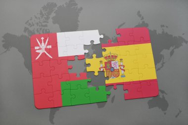 Umman ve İspanya Dünya harita arka plan üzerinde bayrağı ile bulmaca.