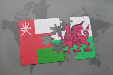 Umman ve dünya harita arka plan üzerinde Galler Ulusal bayrak ile bulmaca.