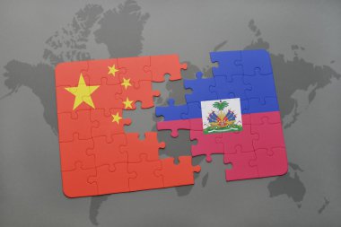 Dünya harita arka plan üzerinde Çin ve haiti Ulusal bayrakla bulmaca.