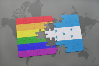 bir dünya haritası arka plan üzerinde honduras ve gay gökkuşağı bayrağı ulusal bayrağı ile bulmaca.