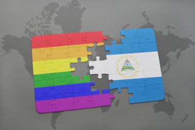 bir dünya haritası arka plan üzerinde nikaragua ve eşcinsel gökkuşağı bayrağı ulusal bayrağı ile bulmaca.
