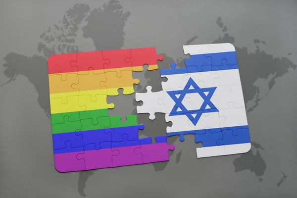 Puzzle with the national flag of israel and gay rainbow flag on a world map background. — Stock Photo, Image