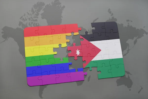 Puzzle with the national flag of jordan and gay rainbow flag on a world map background. — Stock Photo, Image