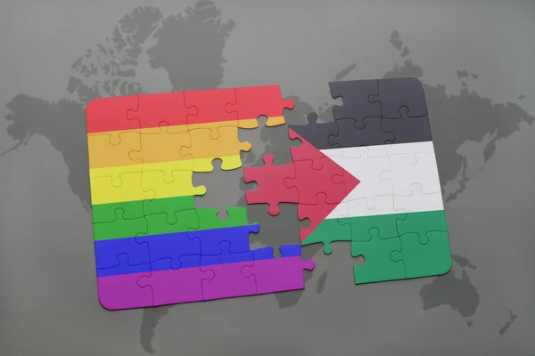 Puzzle with the national flag of palestine and gay rainbow flag on a world map background. — Stock Photo, Image