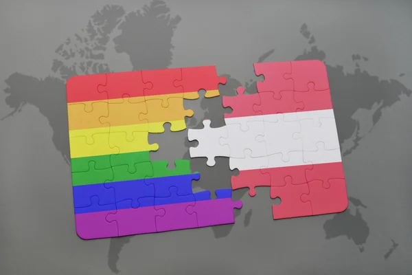Puzzle s národní vlajkou Rakouska a gaye-duhové vlajky na pozadí mapy světa. — Stock fotografie