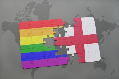 bir dünya haritası arka plan üzerinde İngiltere ve eşcinsel gökkuşağı bayrağı ulusal bayrağı ile bulmaca.