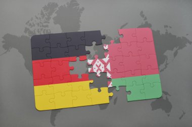 bir dünya haritası arka plan üzerinde Almanya ve Beyaz Rusya ulusal bayrağı ile bulmaca.