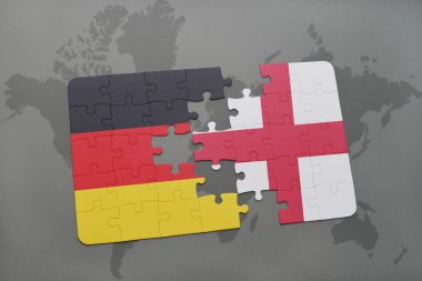 bir dünya haritası arka plan üzerinde Almanya ve İngiltere ulusal bayrağı ile bulmaca.