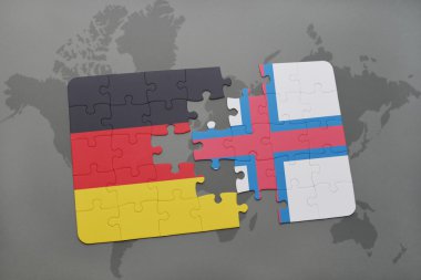 bir dünya haritası arka plan üzerinde Almanya ve faroe adaların ulusal bayrağı ile bulmaca.