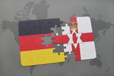 bir dünya haritası arka plan üzerinde Almanya ve Kuzey İrlanda ulusal bayrağı ile bulmaca.