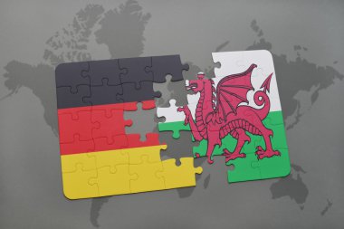 bir dünya haritası arka plan üzerinde Almanya ve Galler ulusal bayrağı ile bulmaca.