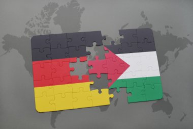 bir dünya haritası arka plan üzerinde Almanya ve Filistin ulusal bayrağı ile bulmaca.