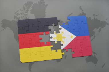 bir dünya haritası arka plan üzerinde Almanya ve Filipinler ulusal bayrağı ile bulmaca.