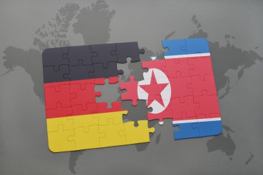 bir dünya haritası arka plan üzerinde Almanya ve Kuzey Kore ulusal bayrağı ile bulmaca.