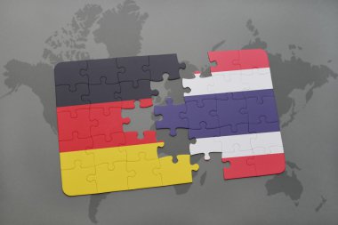 bir dünya haritası arka plan üzerinde Almanya ve Tayland ulusal bayrağı ile bulmaca.