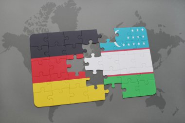 bir dünya haritası arka plan üzerinde Almanya ve Özbekistan ulusal bayrağı ile bulmaca.