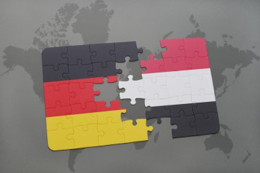 bir dünya haritası arka plan üzerinde Almanya ve Yemen ulusal bayrağı ile bulmaca.