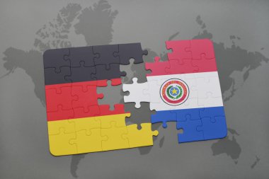 bir dünya haritası arka plan üzerinde Almanya ve Paraguay ulusal bayrağı ile bulmaca.