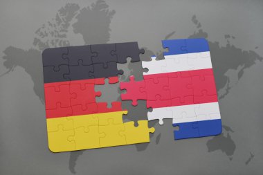 bir dünya haritası arka plan üzerinde Almanya ve Kosta Rika ulusal bayrağı ile bulmaca.