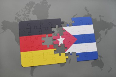 bir dünya haritası arka plan üzerinde Almanya ve Küba ulusal bayrağı ile bulmaca.