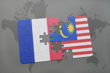 bir dünya haritası arka plan üzerinde Fransa ve Malezya ulusal bayrağı ile bulmaca.