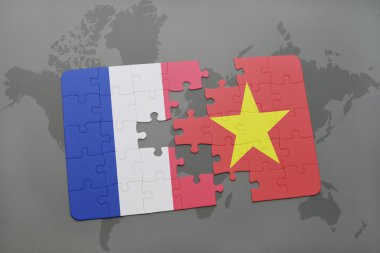 bir dünya haritası arka plan üzerinde Fransa ve Vietnam ulusal bayrağı ile bulmaca.