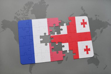 bir dünya haritası arka plan üzerinde Fransa ve Gürcistan ulusal bayrağı ile bulmaca.