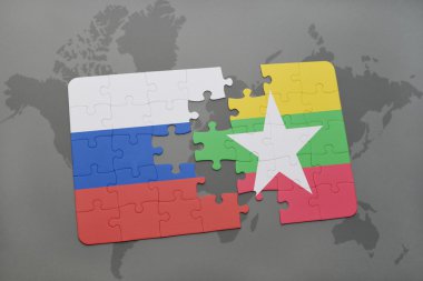 bir dünya haritası arka plan üzerinde Rusya ve Myanmar ulusal bayrağı ile bulmaca.